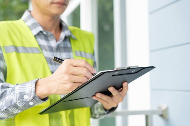 professional construction working with professionals to plan her dream home project